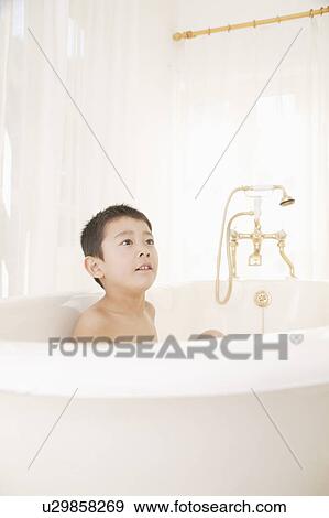 A boy taking bath View Large Photo Image Stock Photo - A boy taking bath. Fotosearch