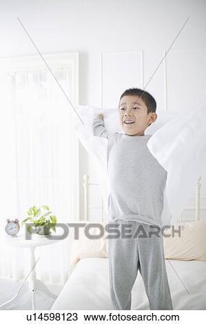 Boy standing in bed View Large Photo Image Stock Image - Boy standing in bed. Fotosearch