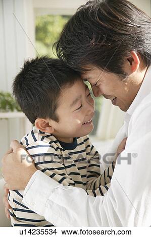 Father and son looking face to face View Large Photo Image Picture - Father and son looking face to face. Fotosearch