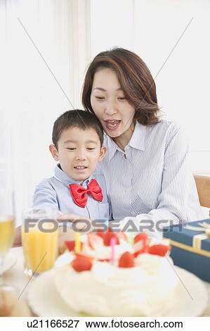 Mother and son celebrating birthday View Large Photo Image Stock Photo - Mother and son celebrating birthday. Fotosearch