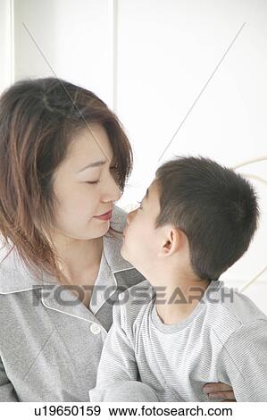 Mother and son looking face to face View Large Photo Image Stock Photo - Mother and son looking face to face. Fotosearch