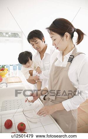 Mother cooking breakfast View Large Photo Image Stock Photo - Mother cooking breakfast. Fotosearch