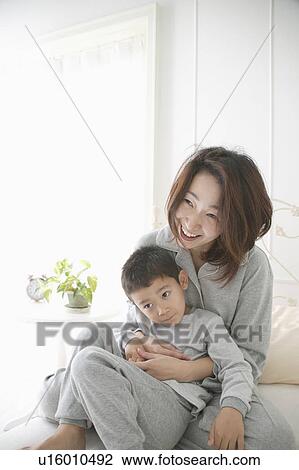 Mother holding son View Large Photo Image Stock Image - Mother holding son. Fotosearch