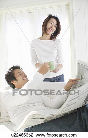 Stock Image - Young couple talking on weekend. Fotosearch