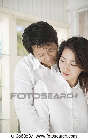 A mid adult man holding mid adult woman View Large Photo Image Stock Photo - A mid adult man holding mid adult woman. Fotosearch