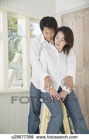 A mid adult man holding mid adult woman View Large Photo Image Stock Photo - A mid adult man holding mid adult woman. Fotosearch