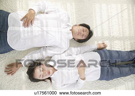 Adult couple sleeping on floor View Large Photo Image Stock Image - Adult couple sleeping on floor. Fotosearch