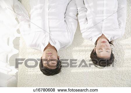 Adult couple sleeping on floor View Large Photo Image Stock Photo - Adult couple sleeping on floor. Fotosearch
