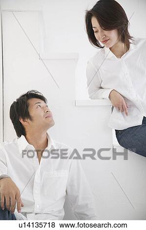 Stock Photo - Adult couple talking face to face. Fotosearch