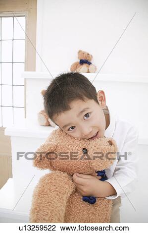 Boy cuddling Teddy Bear View Large Photo Image Stock Image - Boy cuddling Teddy Bear. Fotosearch