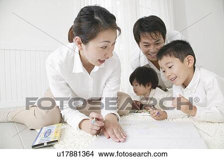 Picture - Family playing with crayon. Fotosearch