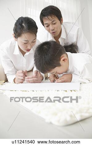 Family playing with crayon View Large Photo Image Stock Image - Family playing with crayon. Fotosearch
