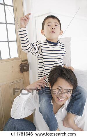 Father giving son piggyback View Large Photo Image Stock Photograph - Father giving son piggyback. Fotosearch