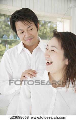 Mid adult couple laughing View Large Photo Image Stock Photo - Mid adult couple laughing. Fotosearch
