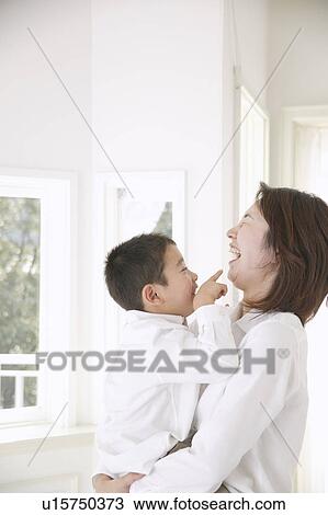 Mother and son having fun View Large Photo Image Stock Image - Mother and son having fun. Fotosearch