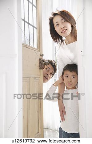 Parents and son standing at entrance View Large Photo Image Stock Image - Parents and son standing at entrance. Fotosearch
