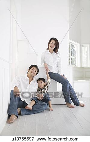 Stock Photo - Portrait of a family on a weekend. Fotosearch