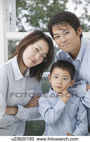 Stock Image - Portrait of a family with glasses. Fotosearch