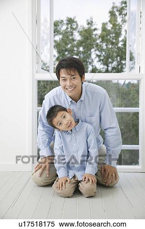 Stock Photography - Portrait of father and son. Fotosearch