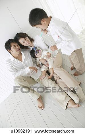 Son playing with bubbles and parents watching with smile. View Large Photo Image Stock Image - Son playing with bubbles and parents watching with smile.. Fotosearch
