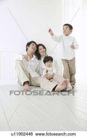 Son playing with bubbles and parents watching with smile. View Large Photo Image Stock Photograph - Son playing with bubbles and parents watching with smile.. Fotosearch