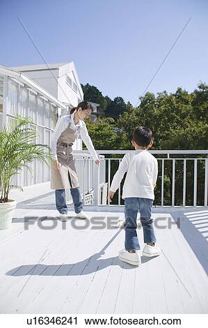 Boy cleaning terrace with mop View Large Photo Image Stock Image - Boy cleaning terrace with mop. Fotosearch
