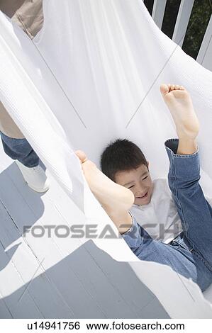 Boy playing with sheet View Large Photo Image Stock Photograph - Boy playing with sheet. Fotosearch