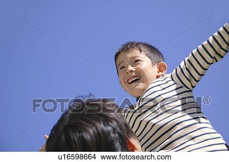 Boy smiling with arms outstretched View Large Photo Image Picture - Boy smiling with arms outstretched. Fotosearch