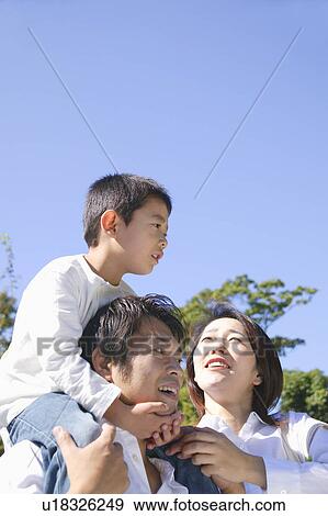 Father giving son piggyback View Large Photo Image Stock Photo - Father giving son piggyback. Fotosearch