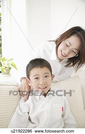 Stock Photograph - Mother and son wearing glasses. Fotosearch