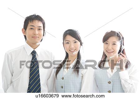 Three young adults with headsets looking at camera View Large Photo Image Stock Photo - Three young adults with headsets looking at camera. Fotosearch