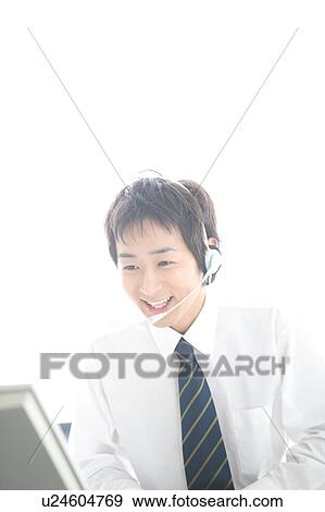 Young man wearing headset View Large Photo Image Stock Photo - Young man wearing headset. Fotosearch