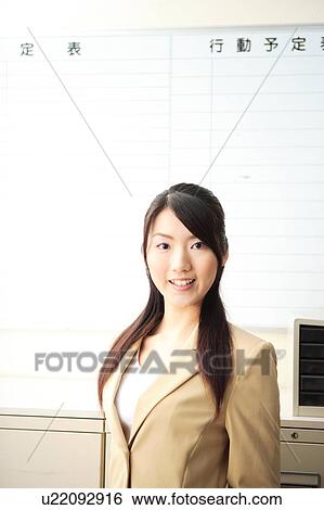 Young woman in front of whiteboard View Large Photo Image Stock Photograph - Young woman in front of whiteboard. Fotosearch