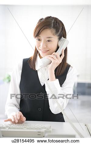 Young woman talking on phone View Large Photo Image Stock Photography - Young woman talking on phone. Fotosearch
