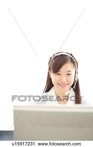 Young woman wearing headset View Large Photo Image Stock Image - Young woman wearing headset. Fotosearch