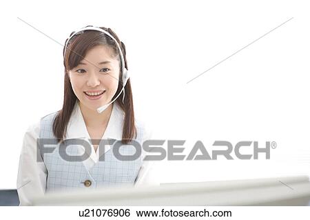 Young woman wearing headset View Large Photo Image Stock Photograph - Young woman wearing headset. Fotosearch