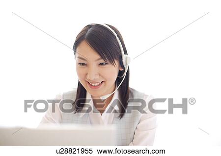 Young woman wearing headset View Large Photo Image Stock Photography - Young woman wearing headset. Fotosearch