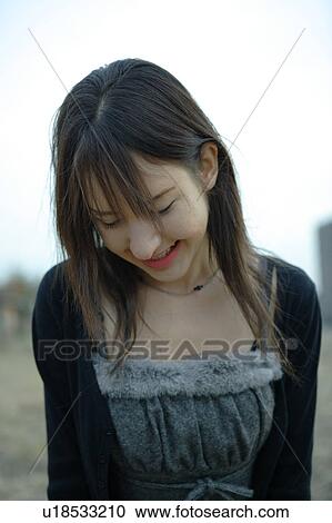 Stock Image - Portrait of young woman. Fotosearch