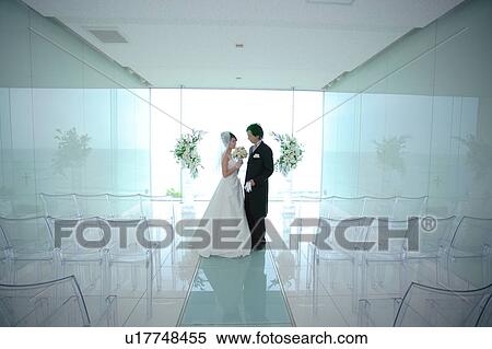 Bride and groom at altar View Large Photo Image Stock Photography - Bride and groom at altar. Fotosearch