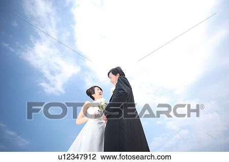 Bride and groom looking at each other View Large Photo Image Stock Image - Bride and groom looking at each other. Fotosearch