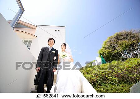 Stock Image - Bride and groom standing. Fotosearch