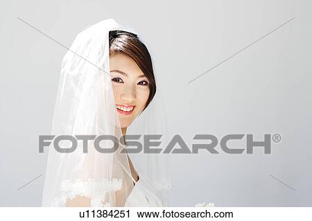 Stock Image - Bride looking at camera. Fotosearch