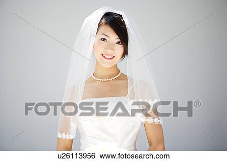 Stock Photograph - Bride looking at camera. Fotosearch
