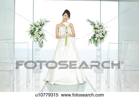 Stock Photography - Bride standing at altar. Fotosearch