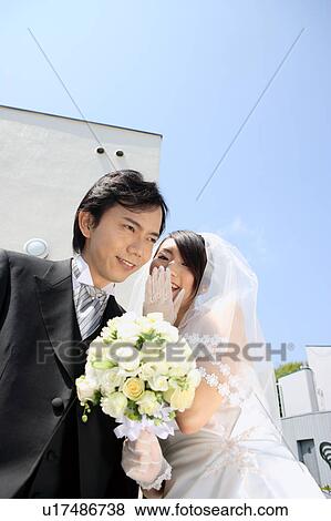 Bride whispering to groom View Large Photo Image Stock Photo - Bride whispering to groom. Fotosearch