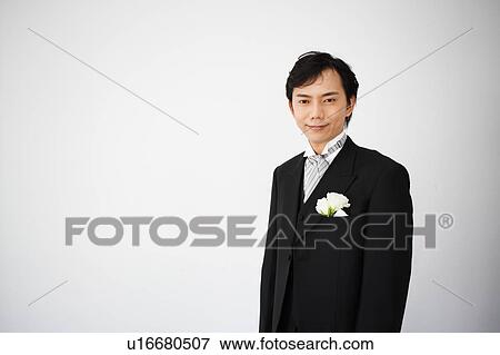 Stock Photo - Groom looking at camera. Fotosearch