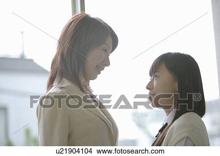 Picture - High school girl in classroom. Fotosearch