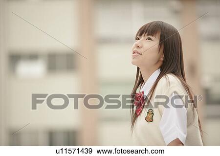 High school girl in schoolyard View Large Photo Image Stock Photo - High school girl in schoolyard. Fotosearch