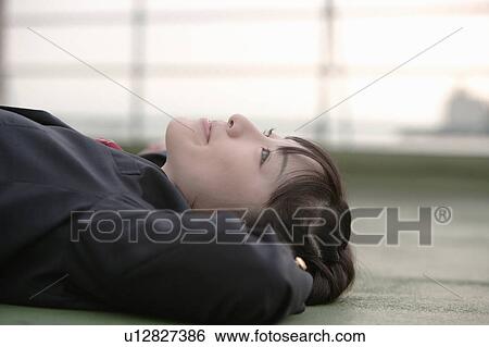 High school girl lying down View Large Photo Image Stock Photograph - High school girl lying down. Fotosearch