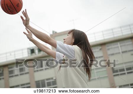 High school girl playing basketball in schoolyard View Large Photo Image Stock Image - High school girl playing basketball in schoolyard. Fotosearch